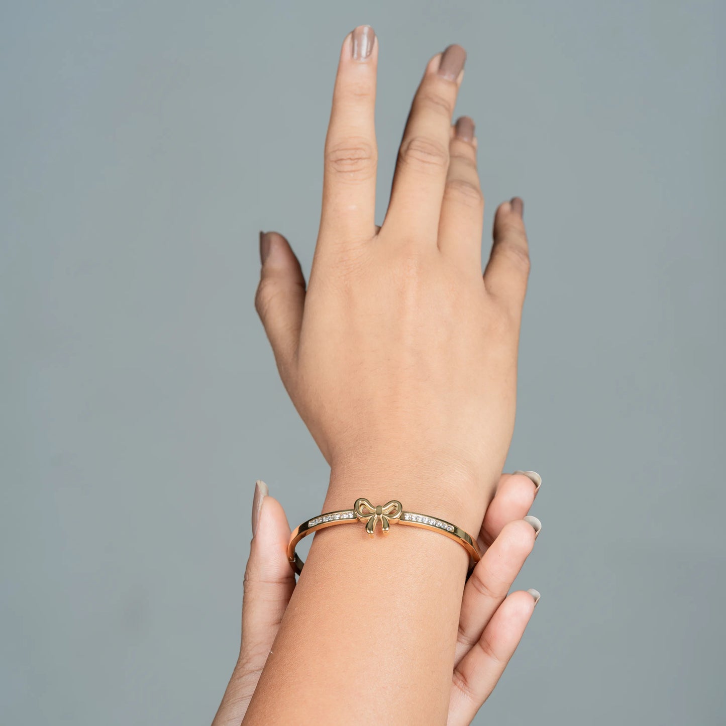 Poise – 18K Gold Plated Gold Bow CZ Bangle